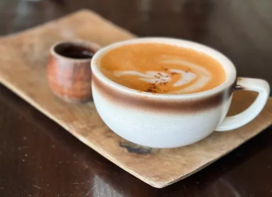 Thai tea latte served on a tray